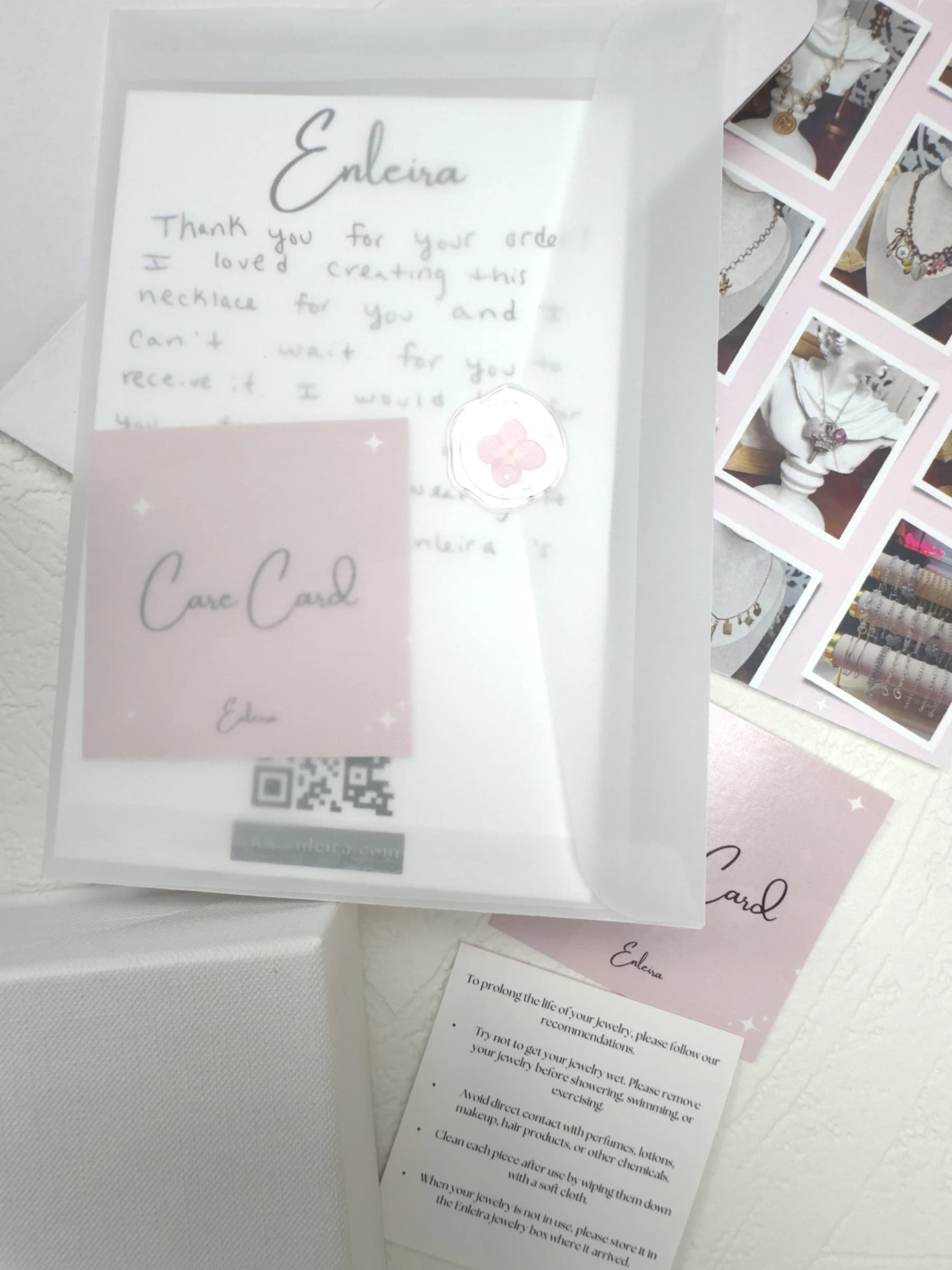 Elegant packaging with a handwritten note, care card, and branding materials in a vellum envelope, by Enleira